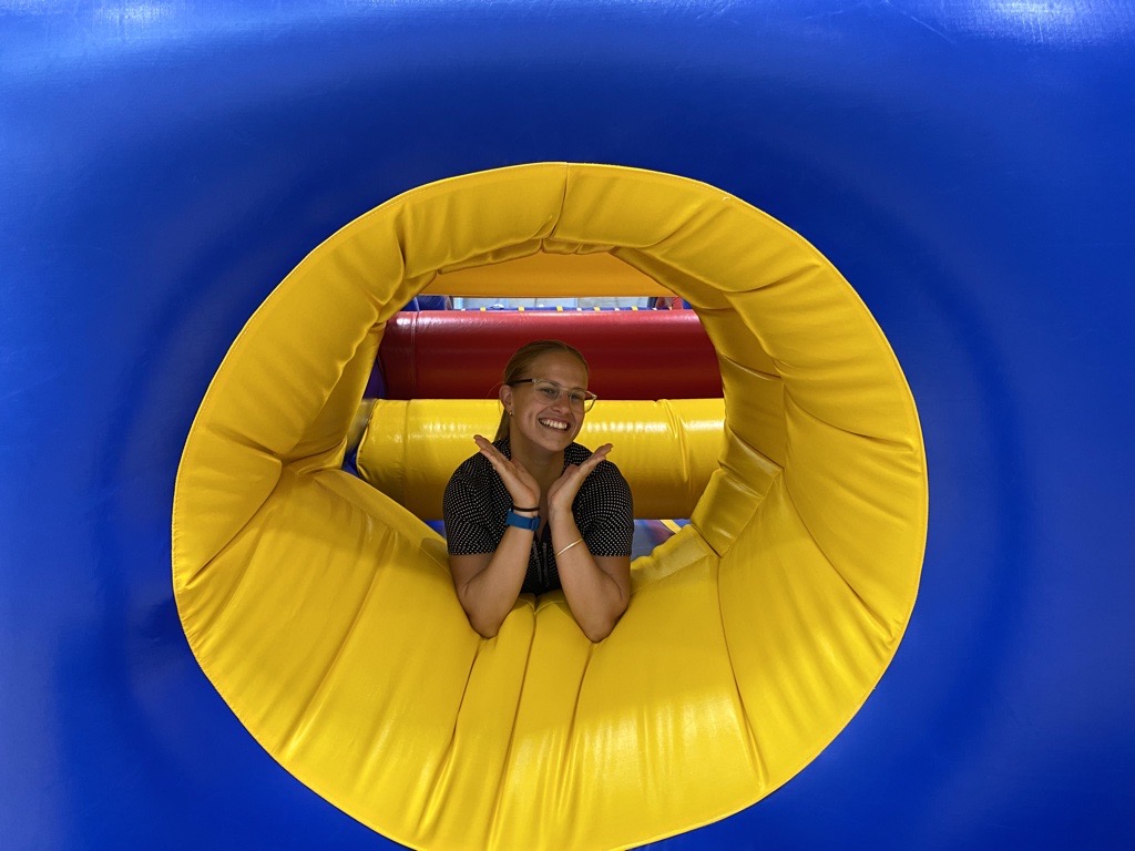 Woman smiling inside an inflatable.