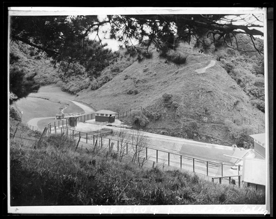 Black and white archive photo of an outdoor pool situated in the hills.