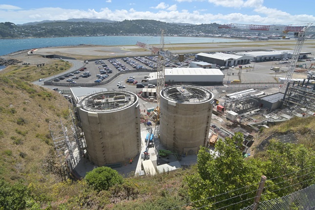 Two digestors at Moa Point Sludge Minimisation Facility surrounded by construction.