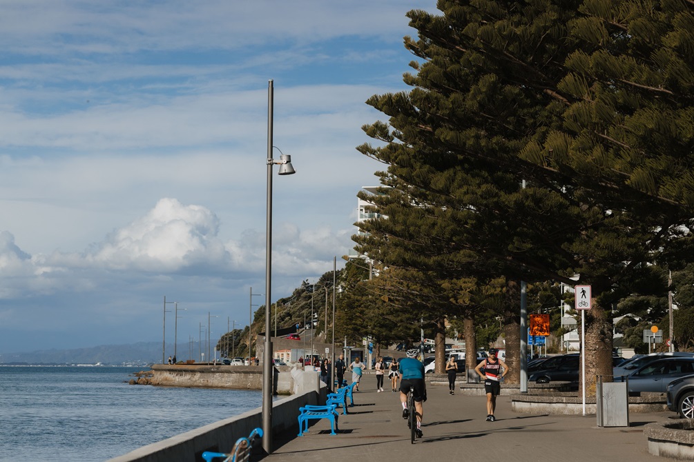 People running and walking down Oriental Parade.