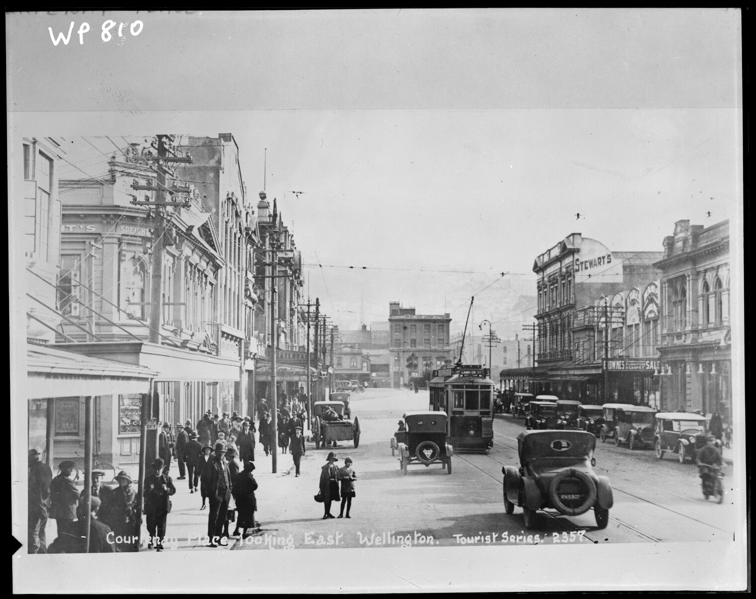  Courtenay Place looking east', but view is towards Taranaki Street intersection. Tramcar bound for Lambton Quay. The Albion Hotel on the left is on the corner of Tory Street and Courtenay Place. Wellington City Council Archives, 00138-810.