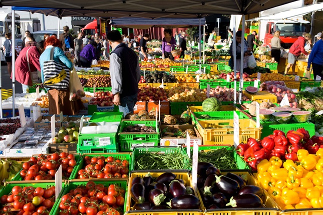 Harbourside Market stalls filled with produce.