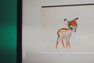 Sketch of Bambi from Bambi the movie, inside a black frame on the wall.