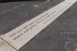 Quotes etched into the pavement.