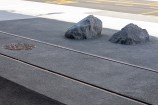 Urban streetscape with a close up of tram lines in the ground.