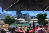 Wellington waterfront with people enjoying food by the lagoon.