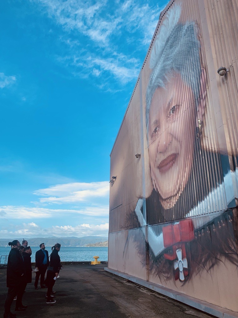 June Jackson mural on the side of a building on the waterfront.