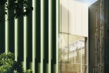 Render design showing exterior view of proposed Town Hall annex during the day.