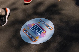 Decal on the ground with feet alongside it.