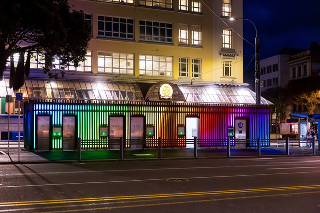 Inglewood Place toilets lit up with colourful light display at night.