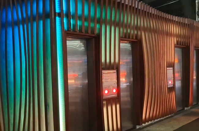 Night time exterior shot of Inglewood Toilet block with coloured lighting display.
