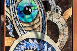 Close up of artwork in a light box exhibition.