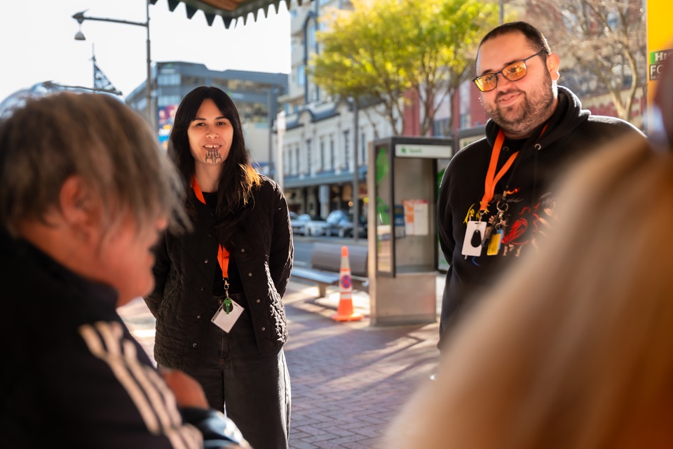 Members of Outreach team talking to community around the streets.
