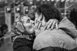 Photo credit EBRAHIM ALIPOOR - Mohammad, 22, shares a final, poignant farewell with his mother before embarking on his journey to Europe. 