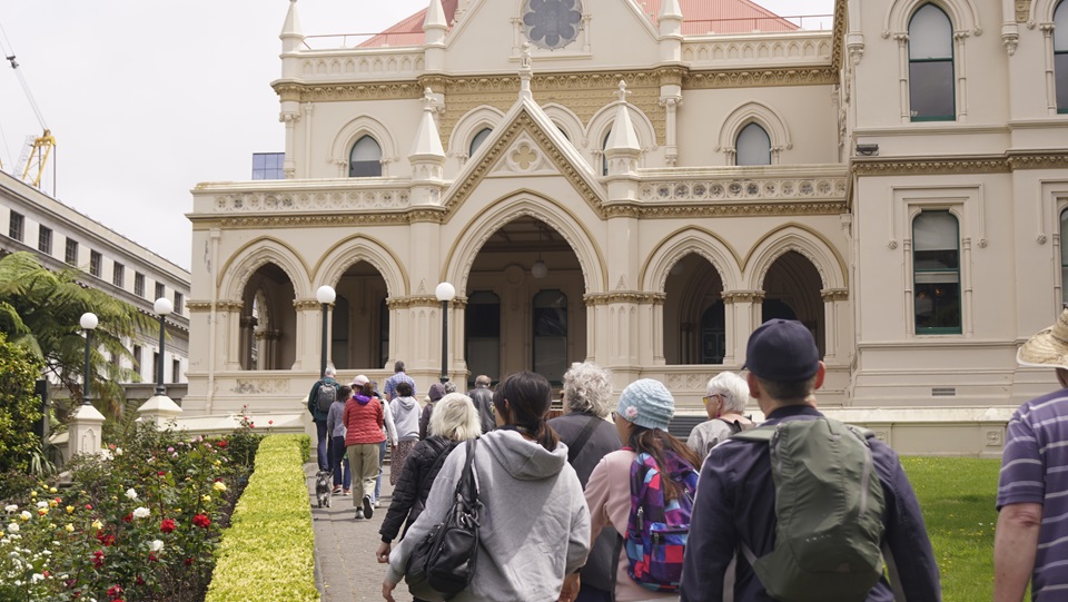 A group of people walking into a church