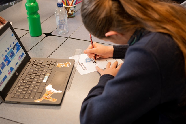 A girl drawing on a paper