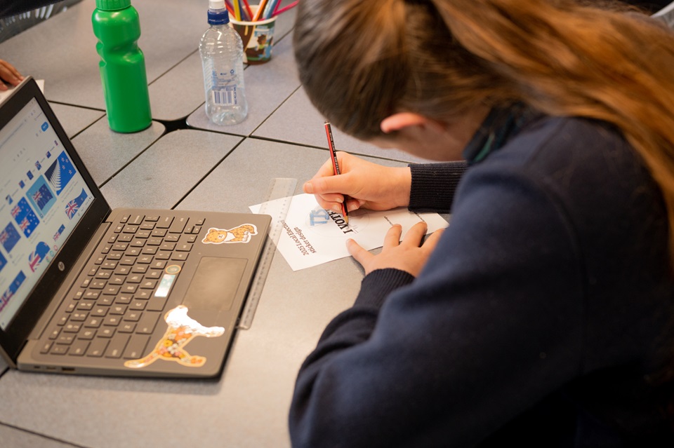 A girl drawing on a paper