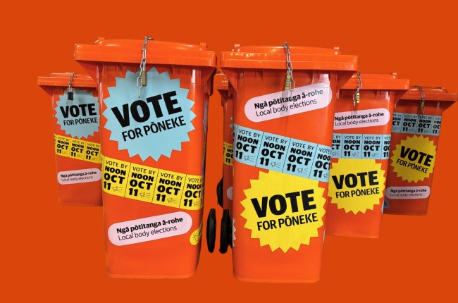 Groups of orange ballot bins with orange background.