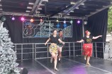Tap dancers performing on stage at a Christmas concert.