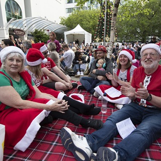 Image of people enjoying carols in Midland Park at A Very Welly Christmas