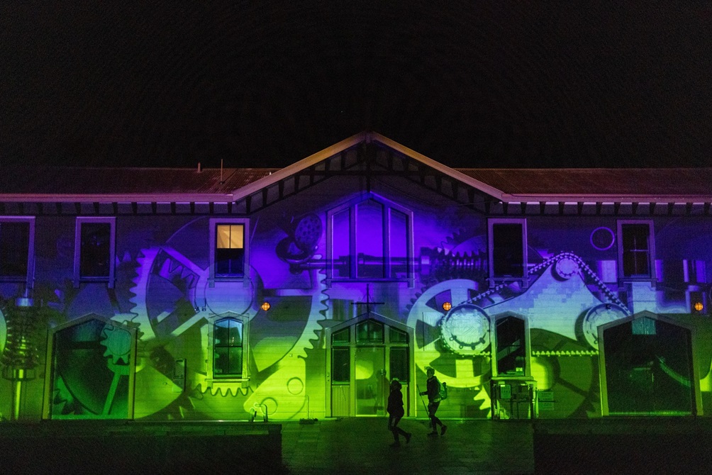 He Moana Whairepo and Amplify, projection on The Boatshed  at nighttime.