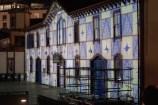 The Star Boating Club on the waterfront lit with an alternating blue and white chequer pattern.