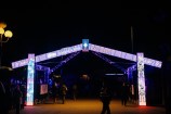 A stylised marae entrance gate constructed from LED panels. It is displaying a changing pattern of animated artworks.