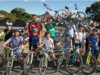 Large group of primary school children on bikes.
