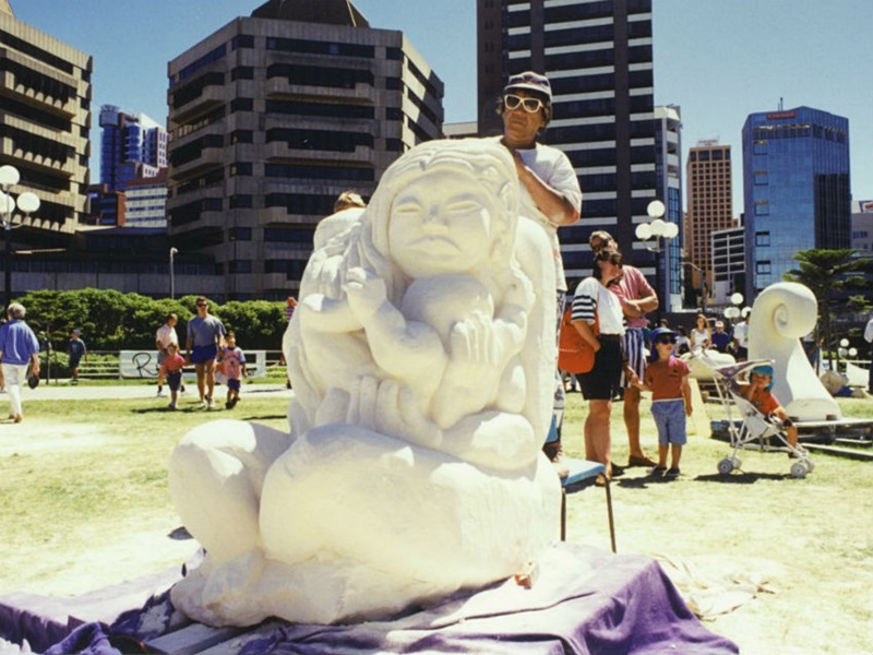 A Maori carver creates a sculpture from Oamaru stone at Waitangi Day celebrations in 1995.