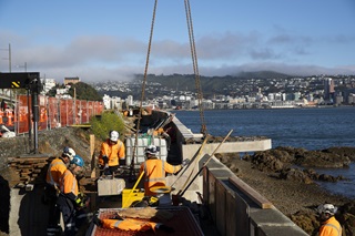 Workers in ditch constructing Evans Bay cycleway.