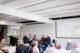 Panel members speaking at the BID summit 2025, including two police officers.