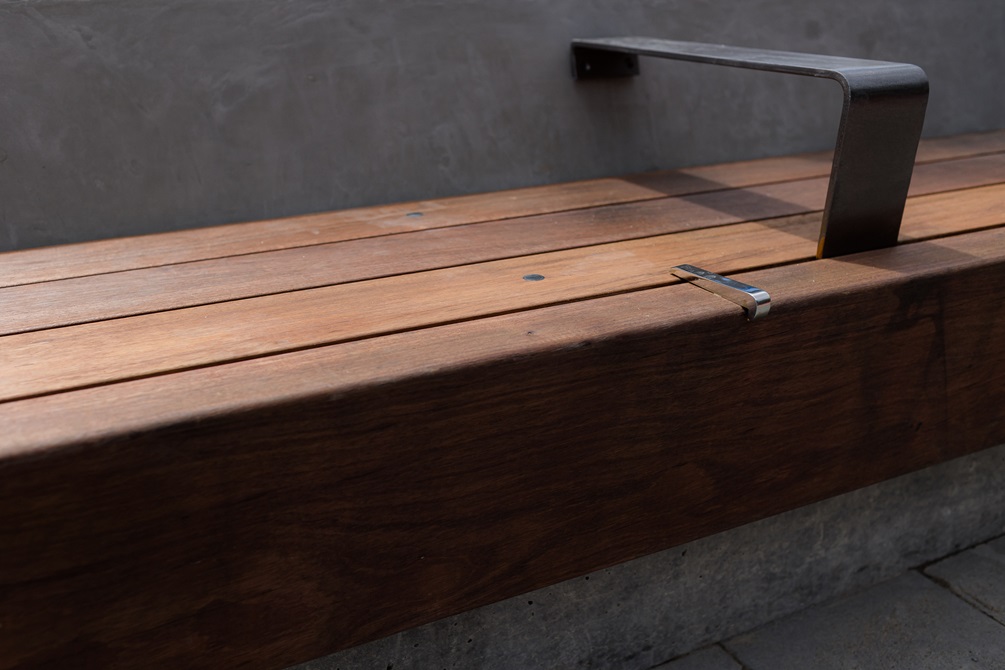 Detail of wooden bench and hand rail.