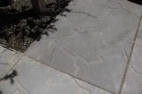 Detail of concrete paving showing engraving of a map of the Karori stream.