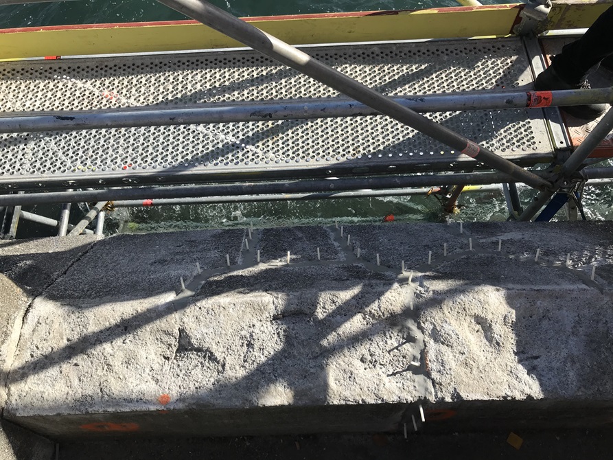 A birds eye view of the grout work being done on the sea wall.