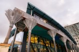 Te Matapihi ki te Ao Nui Central Library Harris Street view with nikau