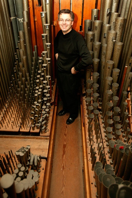 Douglas Mews standing on the great passage board of the Wellington Town Hall organ.