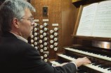 Organist Douglas Mews plays the organ for the last time before it gets dismantled.