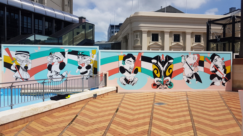 Mural on a section hoarding surrounding the Town Hall. The figures in the artwork depict Kaiaiterangi (sky walkers) and take the form of tiki.
