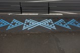 Blue awa markings painted on the bike network path.