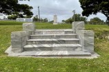 A short flight of steps made of white marble.