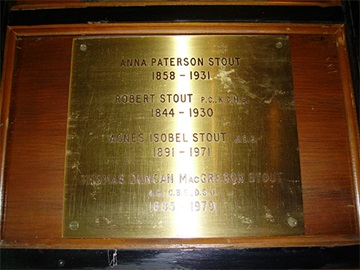 A bronze plaque dedicated to Robert and Anna Paterson Stout.