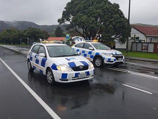 The image shows two cars from the Tawa Community Patrol fleet.