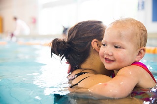 Image of mother and child in swimming pool