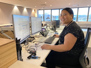 Work experience intern Rosie Lavea sitting at the Wellington City Council’s head office reception desk.