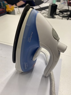 A Sunbeam mini travel iron.