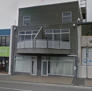A grey three-storey apartment building on Vivian Street in Wellington, with a semi-circle balcony off the second floor. The owner sought funding from Council's Building Resilience Fund to pay for a seismic assessment.
