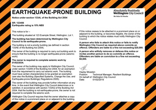 An orange notice for an Earthquake-Prone Building in Wellington.