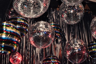 A ceiling full of sparkly disco balls and streamers.