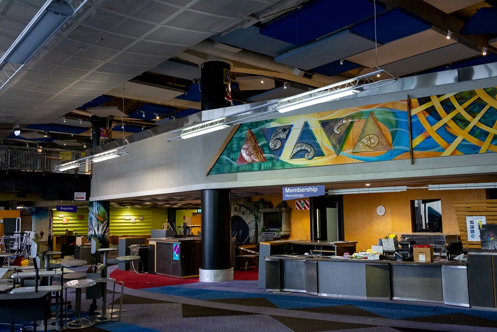 A colourful mural hangs above the membership desk in the Central Library.
