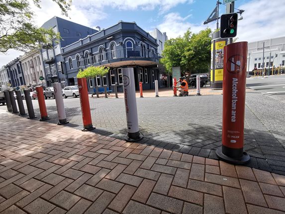 Bollards in CBD with Know Your City Limits advertising